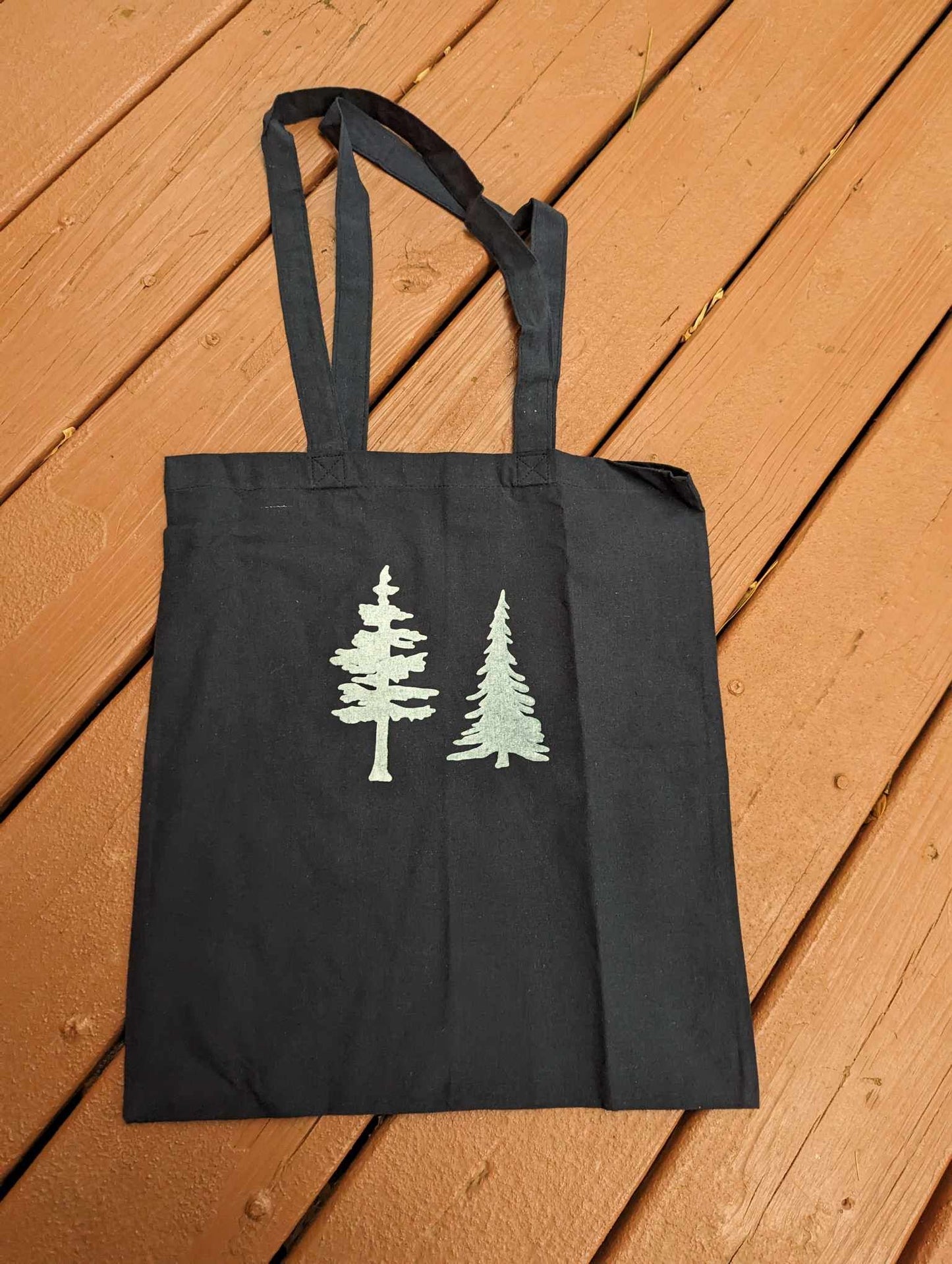 Black tote bag with tree print